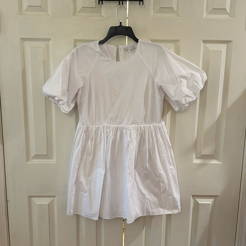 White English Factory mini dress with puff sleeves and pockets.